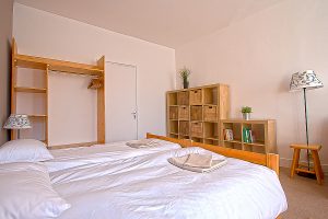 A bedroom with shelves