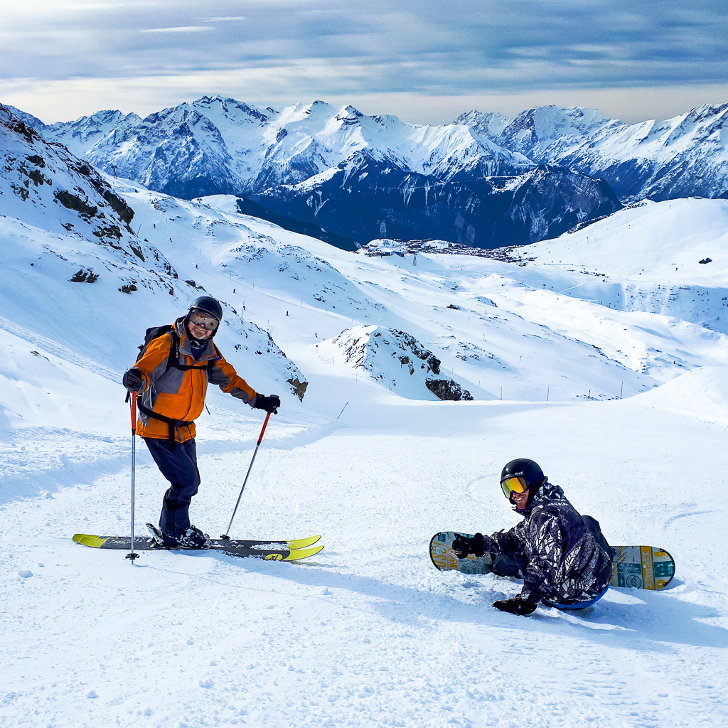 rent skis in oz skier and snowboarder on piste